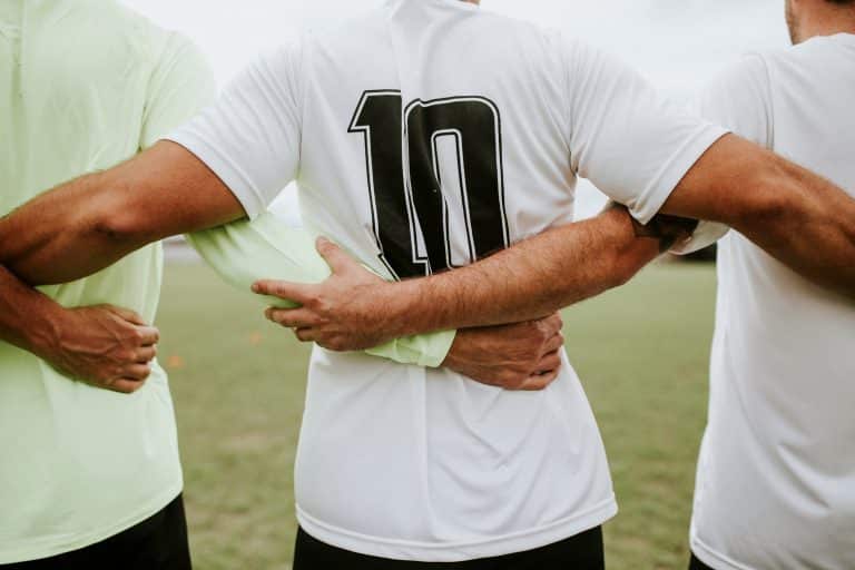 A corporate team proudly wearing custom design jerseys—displaying unity, comfort, and brand identity in motion.