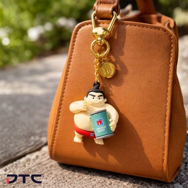 Custom keychains featuring sumo character designs developed for Nippon Paint