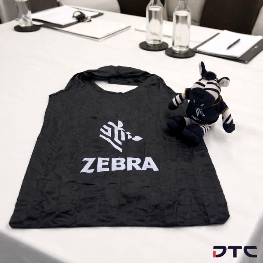 Custom Zebra Technologies plush with foldable bag for corporate gift Malaysia and branded merchandise