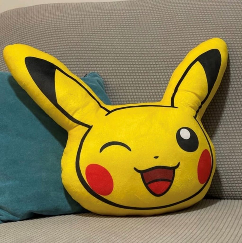 Pikachu cushion on sofa