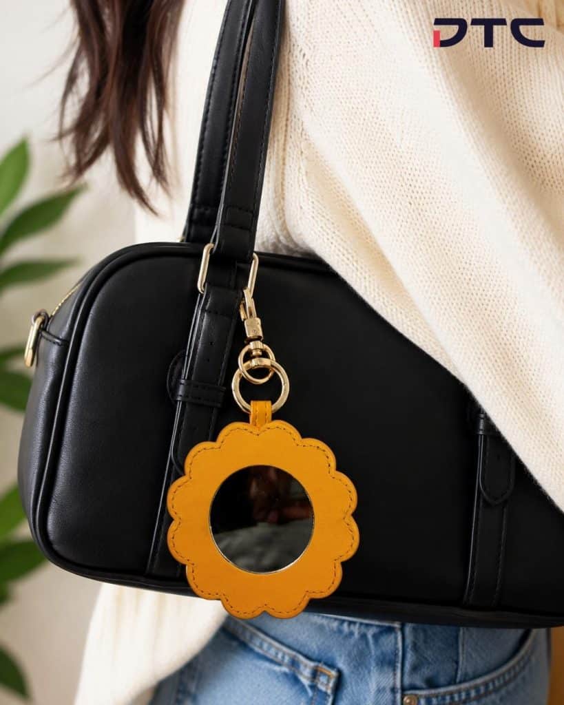 Fashion-inspired collectible bag charm cum mirror